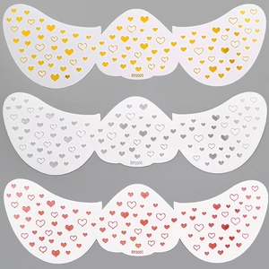Three metallic heart-patterned freckle stickers in gold, silver and red finish