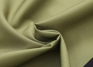 Close-up of olive green twill fabric showing high-quality textile texture and drape