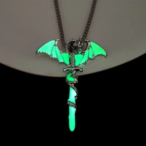 Luminous dragon wrapping around a sword pendant glowing green in dark background