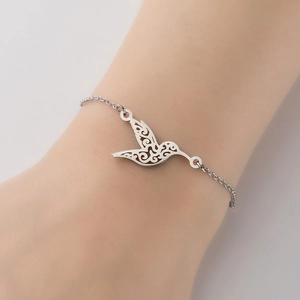Elegant hummingbird bracelet in silver finish on woman wrist for a retro fashion look