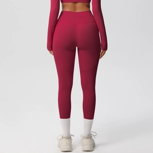 Detail view of high-waist yoga leggings in dark red with premium brushed texture