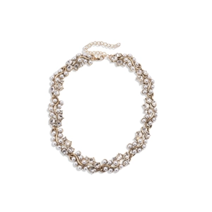 Vintage style gold necklace with oval pearls and rhinestones on white background