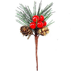 Close-up of artificial pine needles with red berries and pine cones for Christmas decor