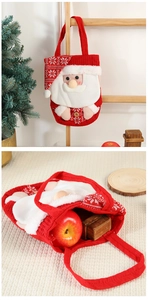 Detail of red Santa knit Christmas gift bag with 3D plush doll and durable carry handle