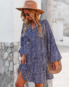 Detail of V-neck leopard print tiered dress with long sleeves in navy blue and white