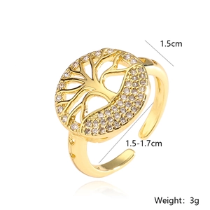 Gold plated Tree of Life open ring with cubic zirconia crystals on white background