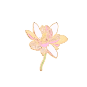Detailed view of enamel lotus brooch with pink petals and gold metal finish