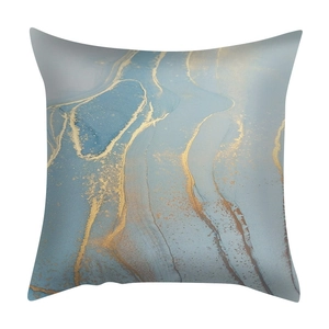 Detailed view of luxury blue and gold marble pattern texture on a square cushion cover