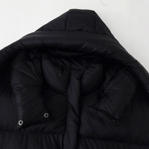 Women's minimalist black hooded padded jacket with shiny finish and silver snap buttons