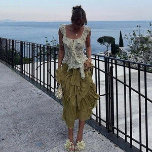 Lace top with ruffles and tiered olive green skirt for a stylish vacation look