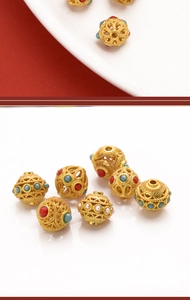 Macro view of gold hollow dragonfly eye beads with colorful enamel inlays for DIY jewelry