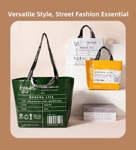 Three large waterproof shopping bags in green, white and yellow with Modern Life prints