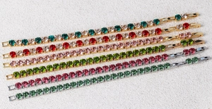 Detail of 6mm round zircon tennis bracelets in gold and silver plating with multi-color stones