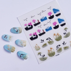 Macro detail of Chinese style 5D nail art stickers with cranes and cherry blossom designs