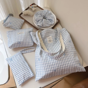 Detailed set of blue checkered cotton bags with elegant blue bow embroidery details