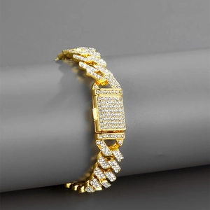 Close-up of 12mm golden Cuban link necklace with iced out rhinestones and square buckle