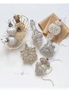 Macro shot of luxury silver Christmas ornaments with sequins, pearls and squirrel details