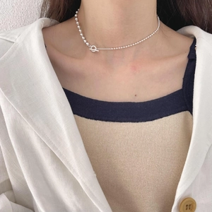 Minimalist 925 sterling silver bead necklace with OT toggle clasp on female model
