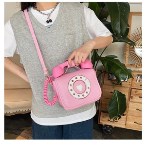 Creative pink rotary phone shaped crossbody bag made of premium PU leather for women