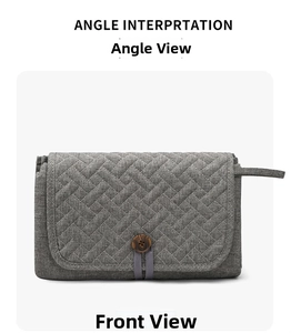 Front view of a gray quilted portable baby changing mat with a vintage wooden button