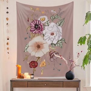Detailed view of floral wall tapestry with vintage flowers hanging in a cozy room