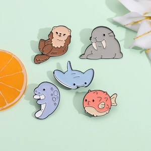 Set of 5 cartoon sea creature enamel pins featuring cute shark and whale metal badges