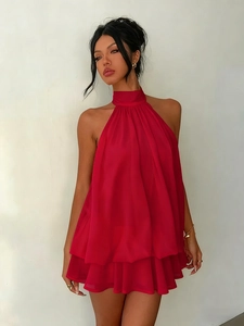 Detail of red tiered chiffon halter mini dress showing layered ruffles and fabric texture