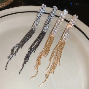 Luxurious long tassel earrings with sparkling rhinestones in gold and gunblack finishes
