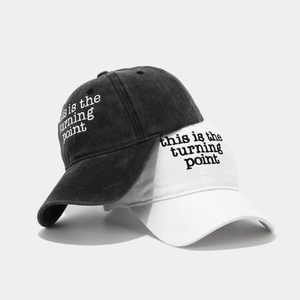 Washed cotton baseball caps in dark grey and white with side letter embroidery