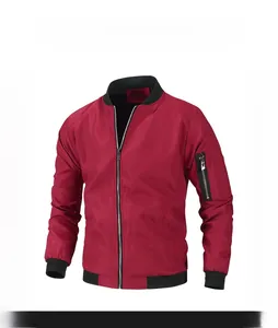 Detail of red bomber jacket featuring black ribbed collar and sleeve zipper pocket