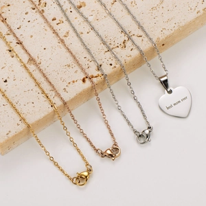 Polished 18k gold and silver heart necklaces with Best Mom Ever engraving on stone