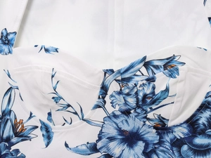 Detailed close-up of floral print top showing high-quality stitching and fabric texture