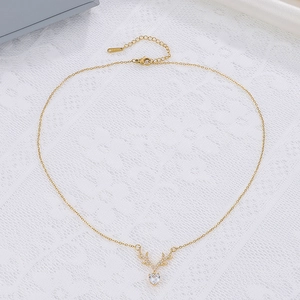 Detailed view of gold elk horn necklace with heart zircon and adjustable lobster clasp