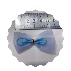 Close-up of light blue mesh bow accessory with pink stripe detail, 6cm width measurement