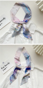 Artistic oil painting silk scarf tied on a white shirt collar as a stylish accessory