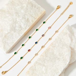 Elegant gold stainless steel anklets with colorful teardrop zircon charms on stone base