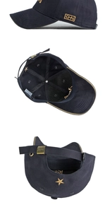 Detail view of navy cotton baseball cap with gold CHN embroidery and adjustable metal buckle