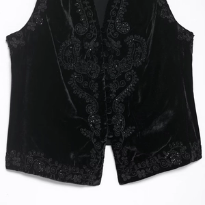 Ethnic style black velvet vest with intricate beadwork and floral embroidery details