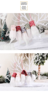 Detailed view of handmade knitted Christmas gnome ornaments with colorful striped hats