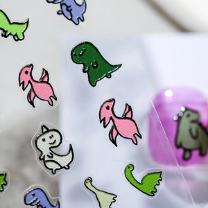 3D embossed cartoon dinosaur nail art stickers with colorful transparent adhesive designs