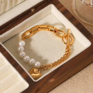 Golden stainless steel heart pendant pearl bracelet with OT clasp in a wooden box