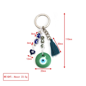 Detailed size specifications of pink evil eye keychain with tassel and heart charm