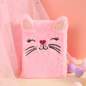 Detailed close-up of pink plush cat notebook featuring sequined ears and embroidery