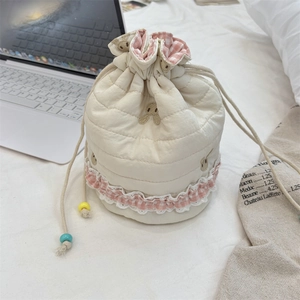 Quilted cotton drawstring pouch with rabbit embroidery and pink checkered ruffle trim