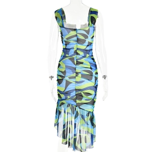 Detail of blue and green abstract print dress with ruched mesh fabric and ruffled hem