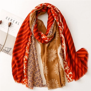 Detailed view of patterned cotton linen scarf with floral motifs and elegant tassels