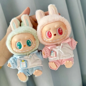 Close-up of cute rabbit plush dolls wearing blue and pink nurse medical uniforms