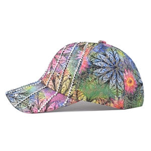 Side view of floral baseball cap with silver rhinestones and star rivets details