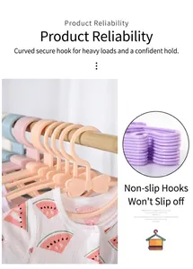 Detail of bow-shaped children hangers with non-slip deep hooks and macaron colors