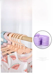 Detail of bow-shaped children hangers with non-slip deep hooks and macaron colors
